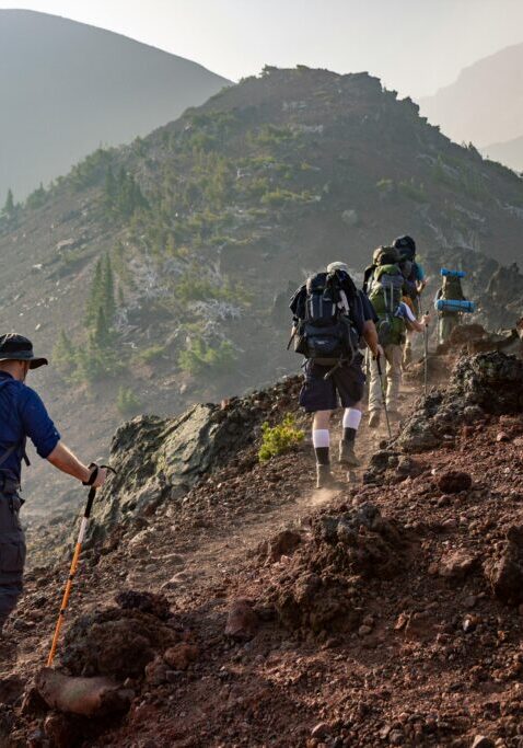 Group of Person Walking in Mountain